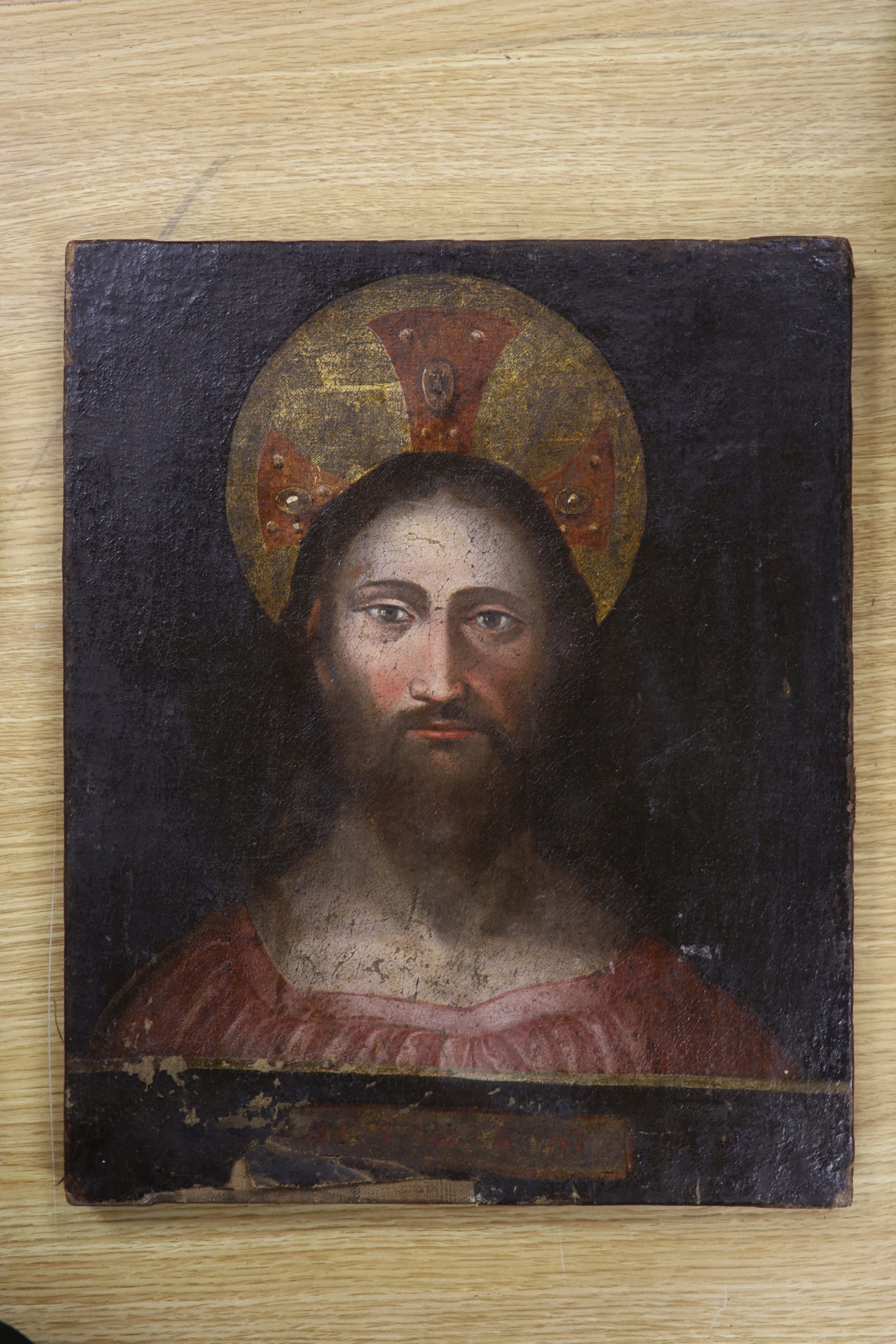19th Century Continental school, icon of Christ, scripted border to base, oil on canvas, 40 x 33cm.